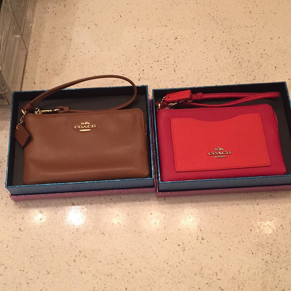 Two Coach wristlets